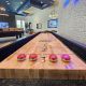 Shuffleboard in the Dwell Oviedo Game Room